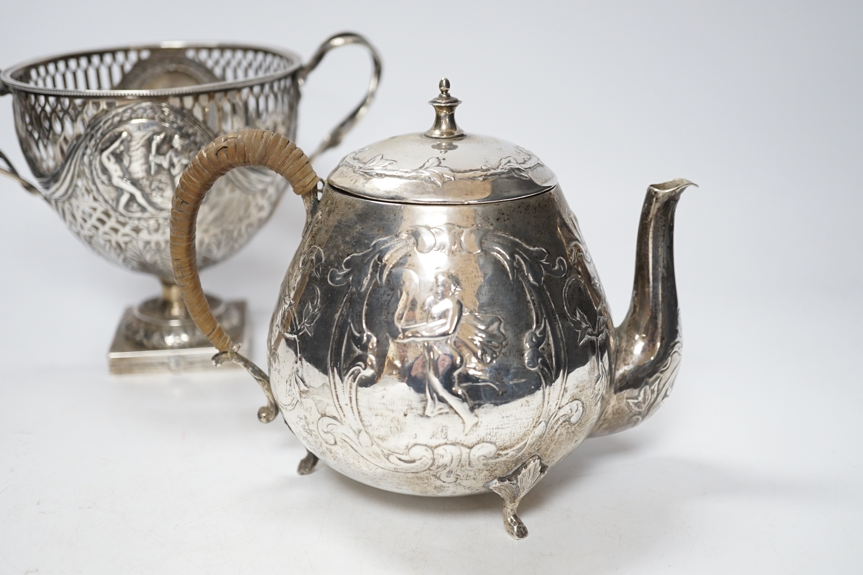 A pair of Thai circular white metal bowls, and a pair of small bowls, all decorated with animals and foliate scrolls, inscribed on bases, diameter 12cm and 8.5cm